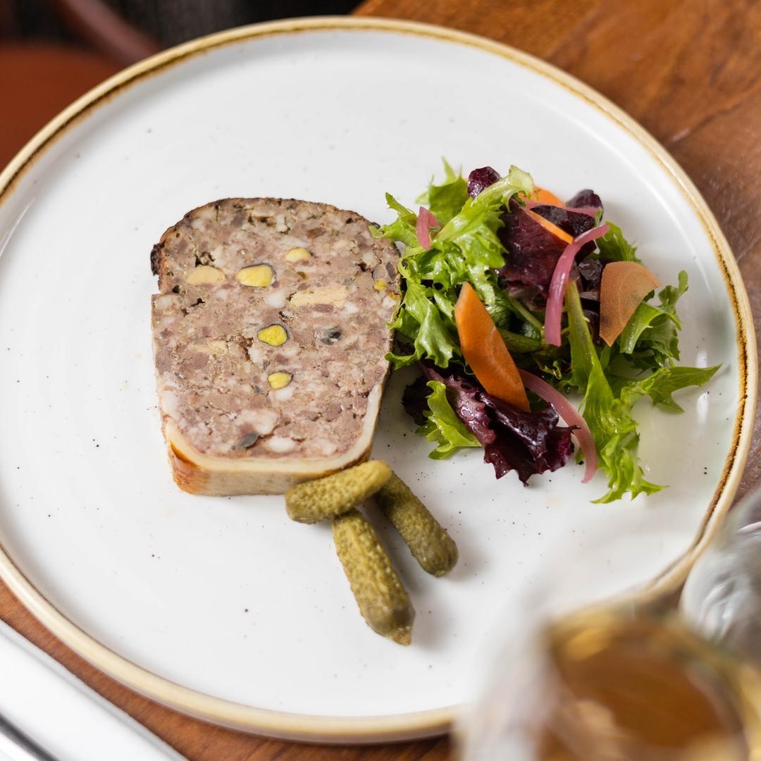 Les Canailles Pigalle serves a perfectly executed terrine de campagne pistachée. (©Laura De Comarmond, Les Canailles Pigalle)